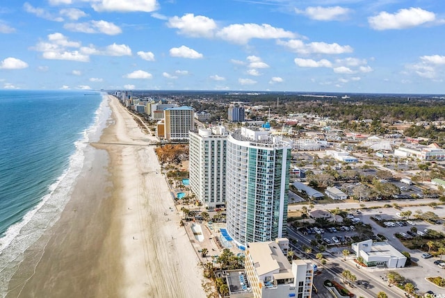 bird's eye view with a view of the beach, a water view, and a city view