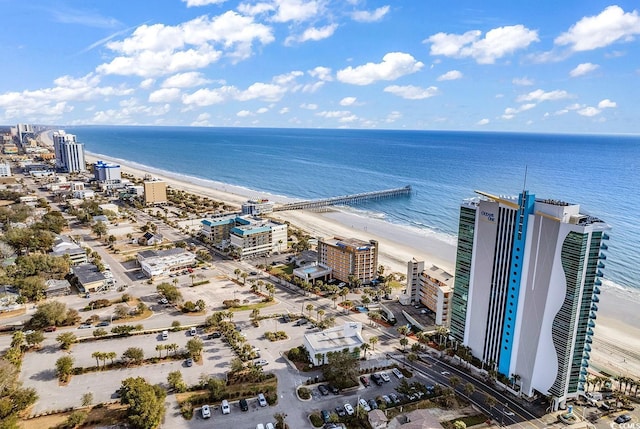 birds eye view of property featuring a view of city, a water view, and a view of the beach