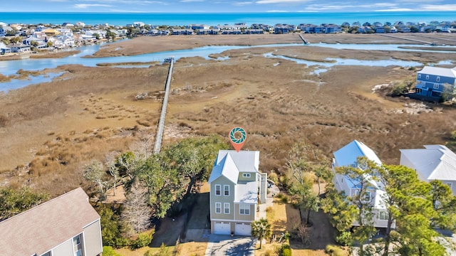 birds eye view of property with a water view and a residential view