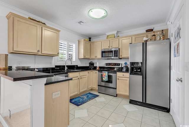 kitchen featuring visible vents, appliances with stainless steel finishes, ornamental molding, a peninsula, and light brown cabinetry