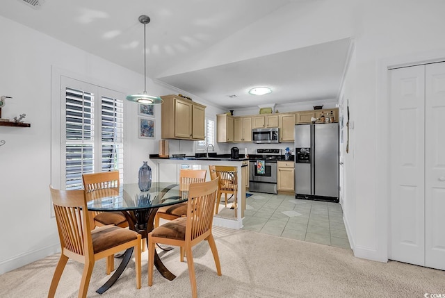 dining area with light tile patterned floors, visible vents, baseboards, light colored carpet, and crown molding