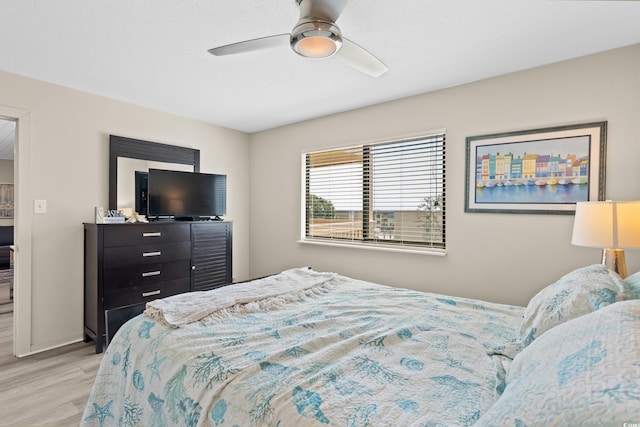 bedroom with ceiling fan and light wood finished floors