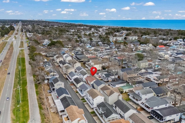 birds eye view of property with a water view and a residential view