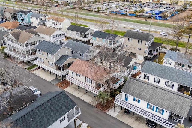 birds eye view of property with a residential view