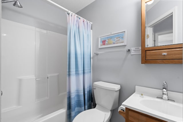 full bath featuring toilet, shower / bathtub combination with curtain, a textured ceiling, and vanity