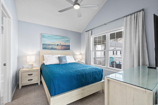 bedroom featuring carpet, vaulted ceiling, baseboards, and ceiling fan