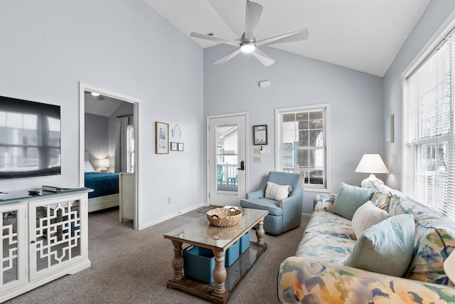 living area with baseboards, carpet floors, a ceiling fan, and a healthy amount of sunlight