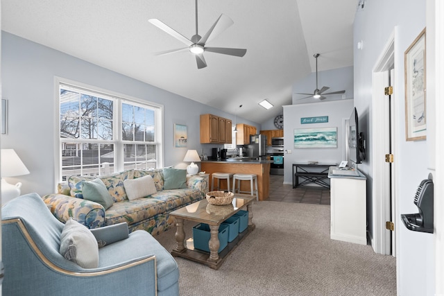 carpeted living area with lofted ceiling, a ceiling fan, and tile patterned floors