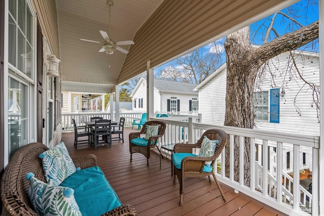 sunroom / solarium featuring a ceiling fan and lofted ceiling