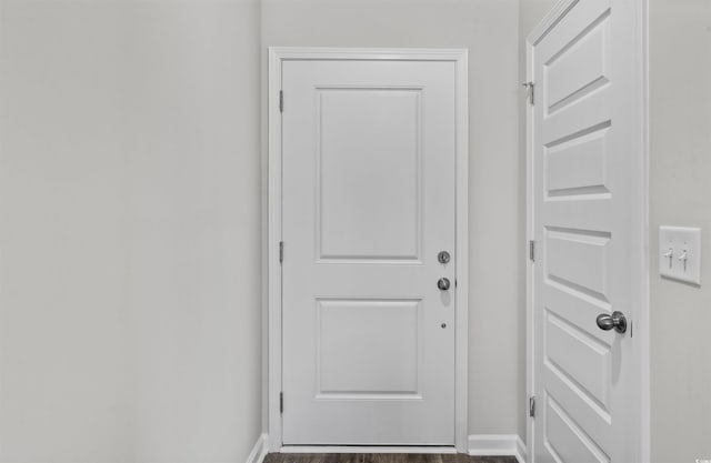 108 Saddle St, Conway, SC 29527 - doorway with baseboards and dark wood-type flooring