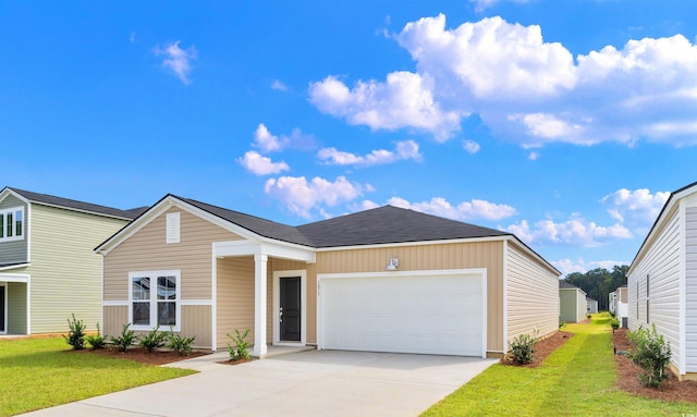 108 Saddle St, Conway, SC 29527 - view of front facade featuring a garage, concrete driveway, and a front lawn