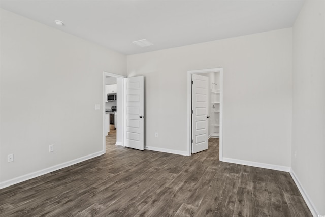 108 Saddle St, Conway, SC 29527 - unfurnished bedroom with dark wood finished floors and baseboards