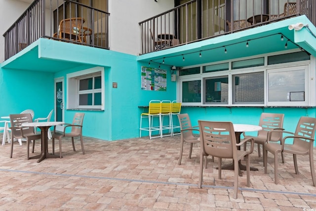 view of patio featuring outdoor dry bar and outdoor dining area