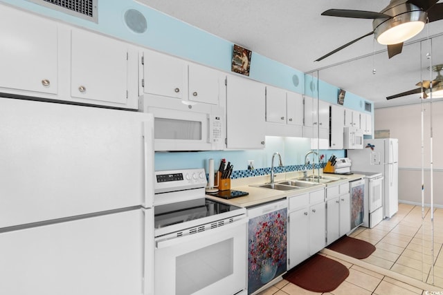 kitchen with ceiling fan, light tile patterned floors, white appliances, white cabinetry, and light countertops