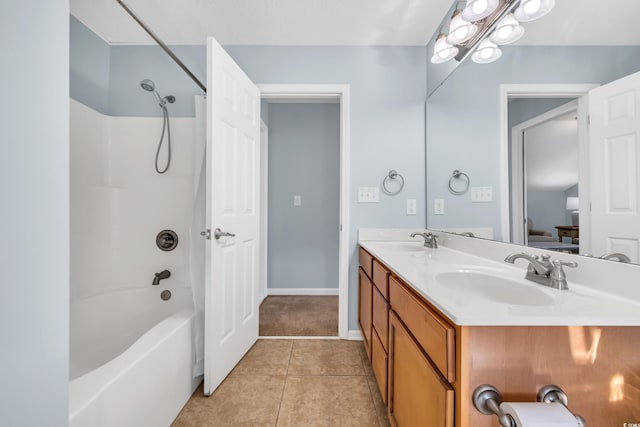 bathroom featuring double vanity, a sink, bathing tub / shower combination, and tile patterned floors