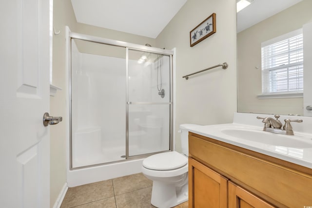 bathroom with toilet, tile patterned flooring, vanity, and a shower stall