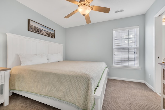 bedroom featuring a ceiling fan, carpet flooring, visible vents, and baseboards