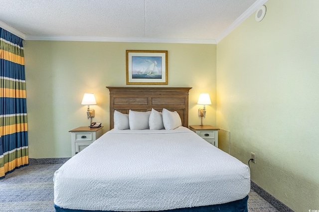 carpeted bedroom with ornamental molding and a textured ceiling