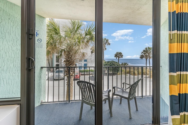 balcony featuring a water view