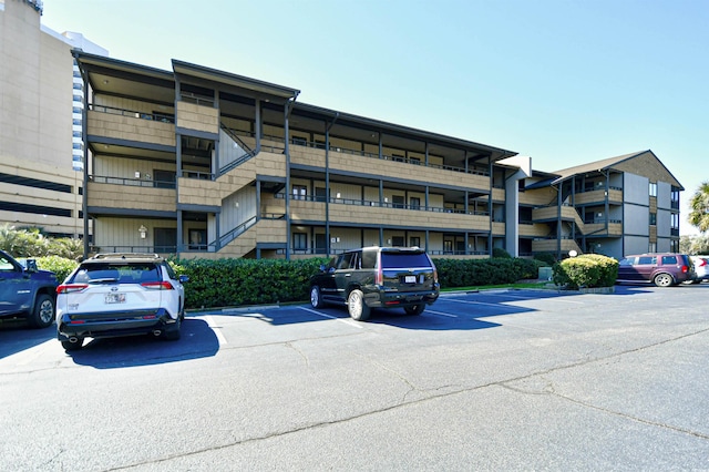 view of property with uncovered parking