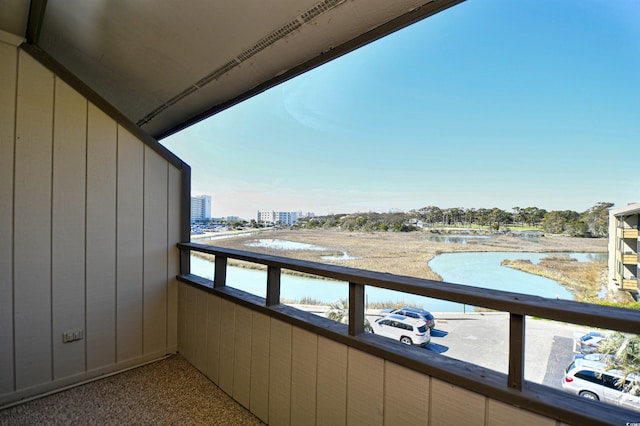 balcony featuring a water view