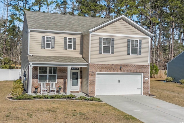 view of front of house featuring driveway, brick siding, a front lawn, and a porch