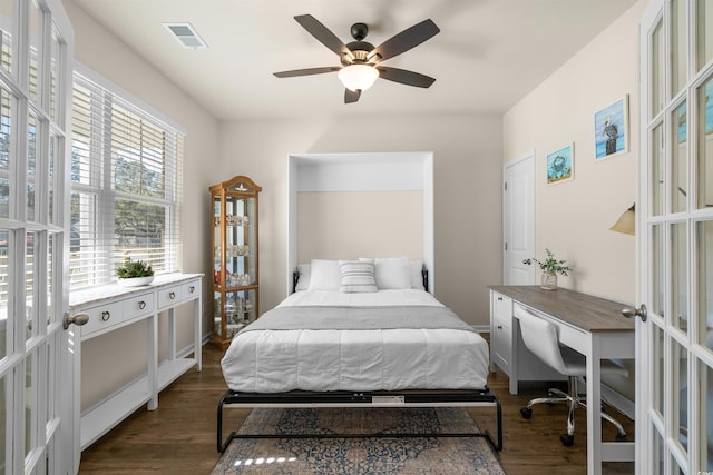 bedroom featuring a ceiling fan, visible vents, dark wood-type flooring, and french doors