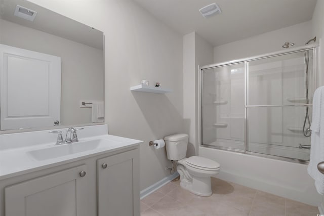 full bath featuring toilet, vanity, visible vents, and tile patterned floors