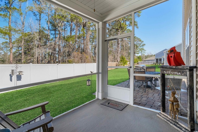 55 Porch Ln, Pawleys Island, SC 29585 - unfurnished sunroom with outdoor dining area