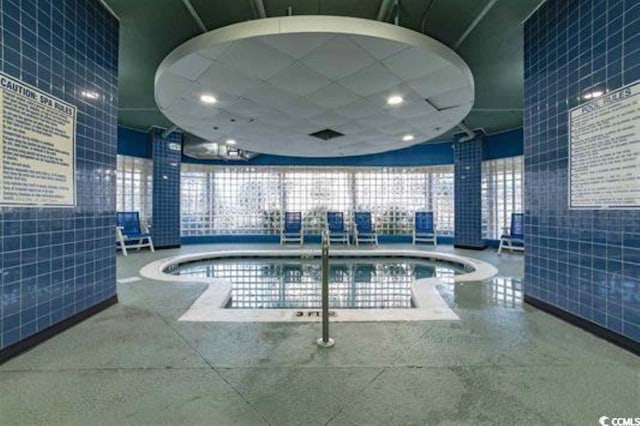 view of pool featuring a jacuzzi