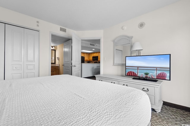 bedroom featuring a closet, visible vents, carpet flooring, and baseboards