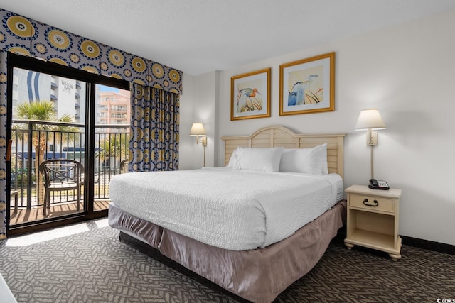 carpeted bedroom with access to outside, multiple windows, and baseboards