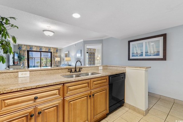 kitchen with a sink, light stone countertops, black dishwasher, and light tile patterned floors