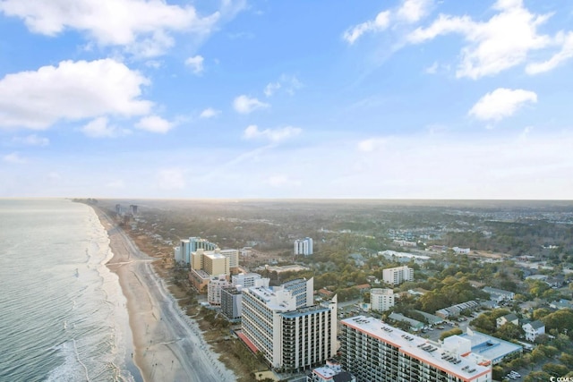 aerial view with a water view, a city view, and a view of the beach