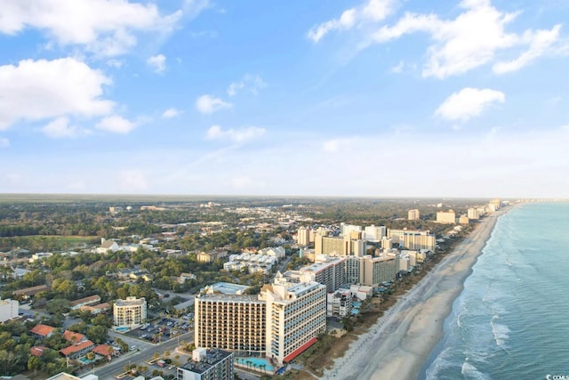 birds eye view of property with a city view, a beach view, and a water view