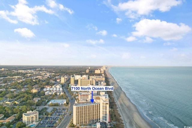 birds eye view of property with a city view, a beach view, and a water view