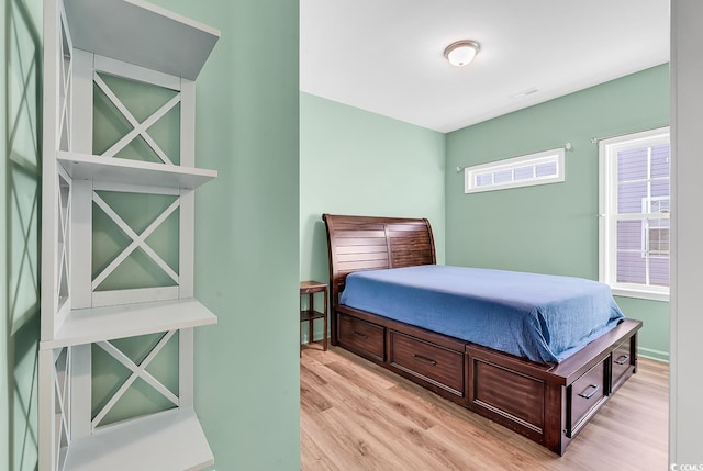 bedroom with light wood-style floors