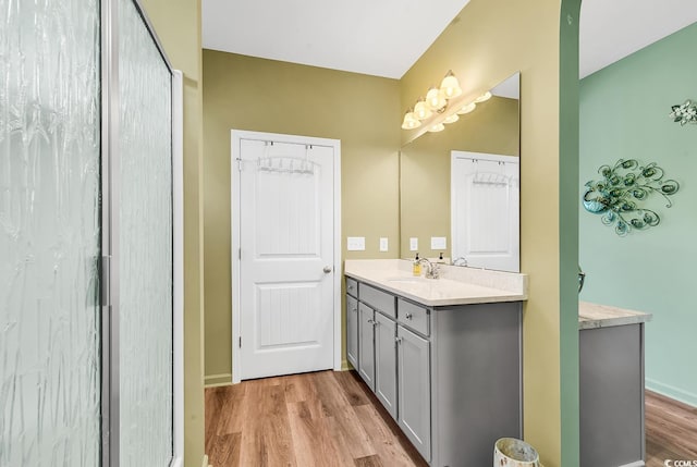 full bath with vanity and wood finished floors