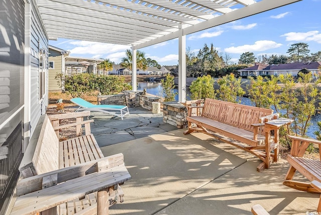 view of patio / terrace with a water view and a pergola