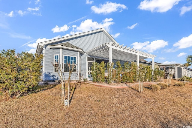 view of home's exterior with a pergola