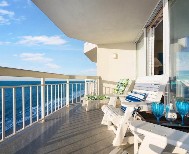 balcony featuring a water view