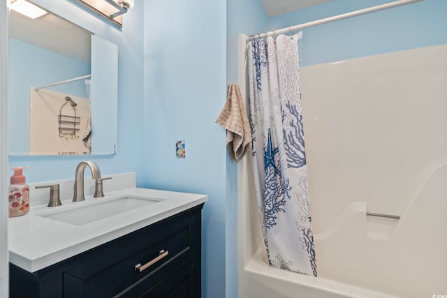 full bathroom with shower / tub combo with curtain and vanity