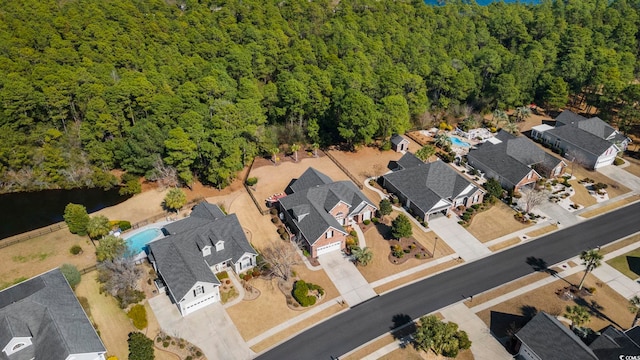 bird's eye view featuring a residential view and a view of trees