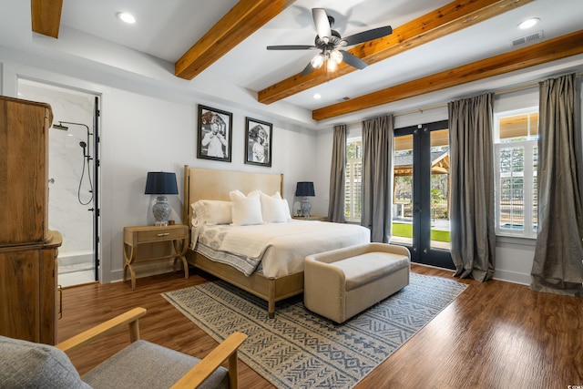 bedroom with beamed ceiling, wood finished floors, visible vents, and baseboards