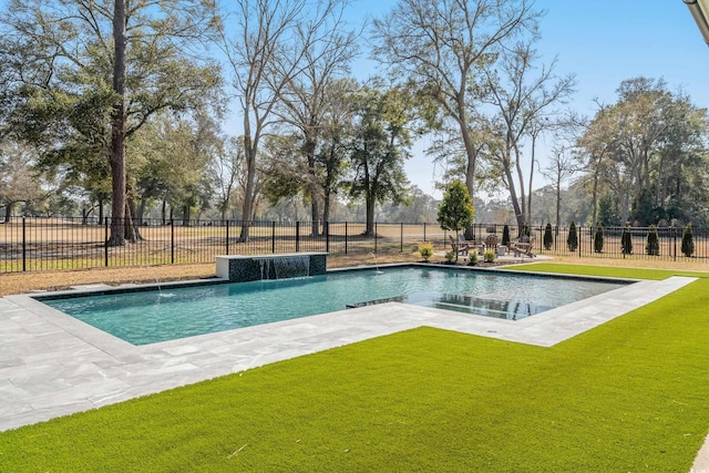 view of swimming pool featuring a patio area, fence, a fenced in pool, and a yard