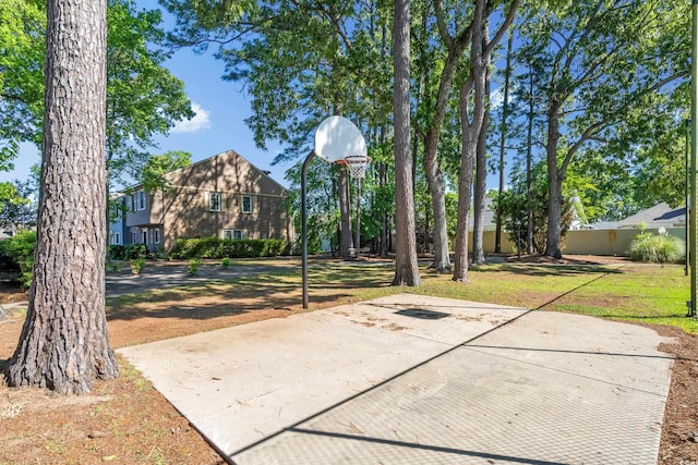 view of sport court with community basketball court and a yard