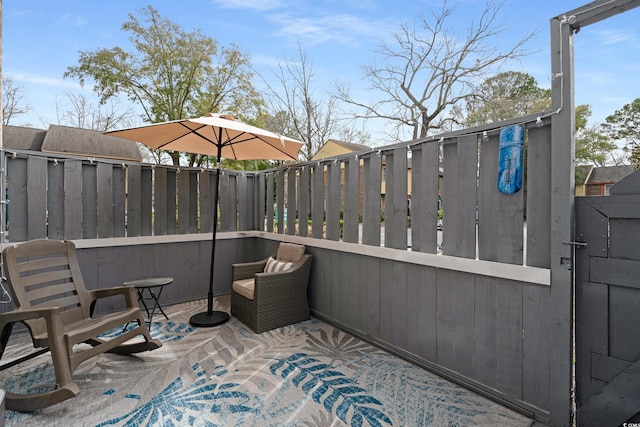 view of patio featuring fence