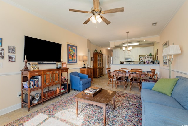 living area with light tile patterned floors, ceiling fan with notable chandelier, visible vents, baseboards, and ornamental molding