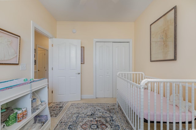 bedroom with a closet and a crib