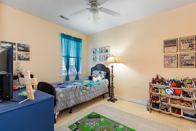 bedroom featuring a ceiling fan, baseboards, visible vents, and carpet flooring